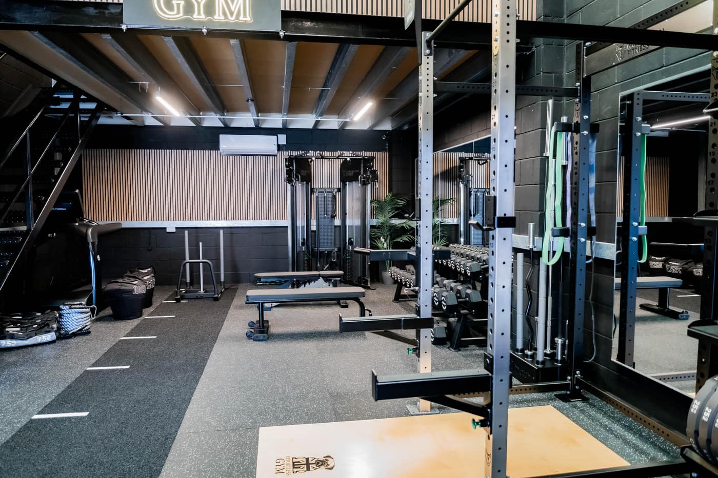 Effortless Gym Poole training floor with custom rig, benches and dumbbell racks
